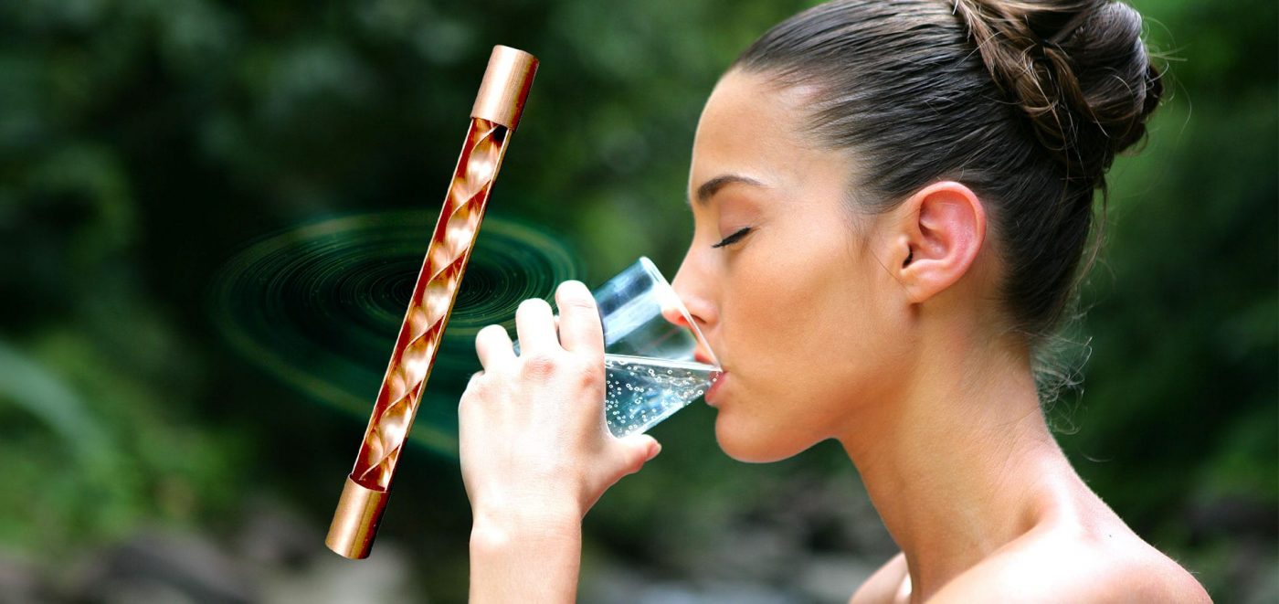 beautiful lady drinking revitalized water from alive water. 