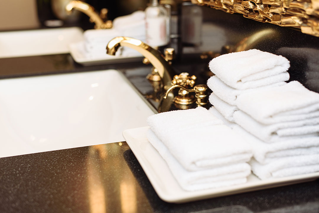 Hotel sink hotel bathroom with a water treatment system 